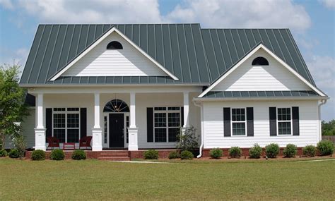 charcoal grey metal roof on blue house|gray metal roofing.